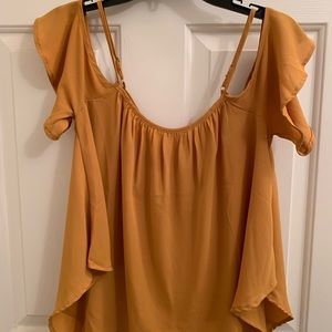 Mustard color, off the shoulders top.